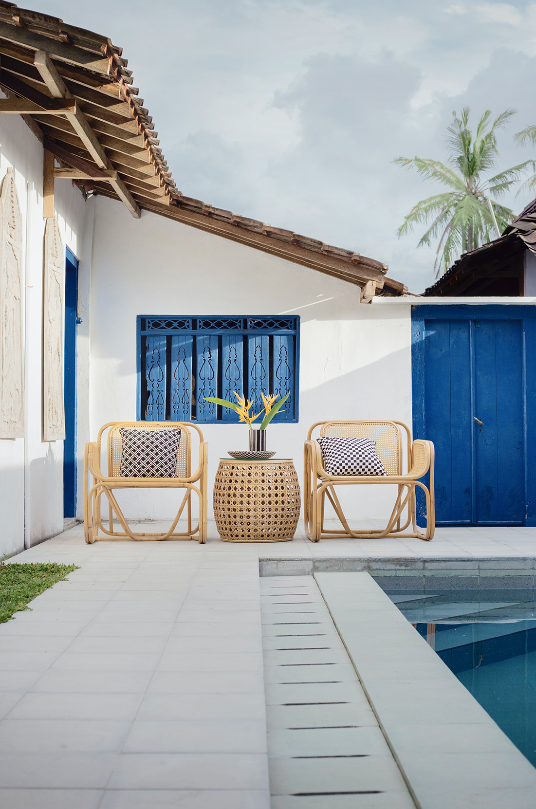 Bistro set next to pool in Spanish style home